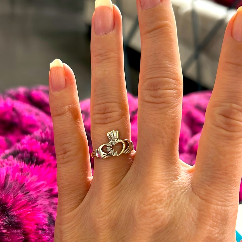Claddagh ring from Ireland with specs of real diamonds. Retail at $1,309